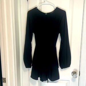 Women’s black long sleeve dress with open back feature. Size L